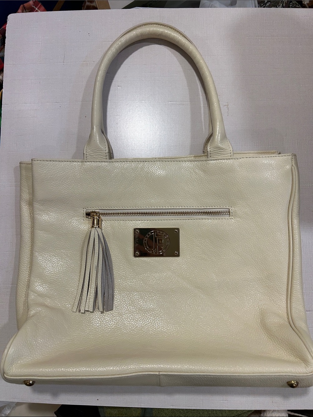 Structured Cream Leather Tote with Tassel Accent